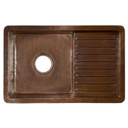 Hammered copper undermount sink with antique brown finish, single basin on left with drain hole and drainboard on right.