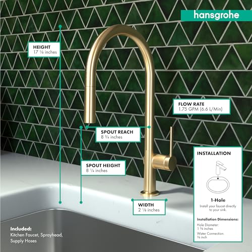 Brushed gold high-arc kitchen faucet with pull-down sprayer mounted on white countertop against green tile backsplash, showin