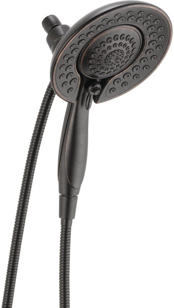 Dual-function showerhead with perforated spray face and handheld attachment connected by flexible hose.