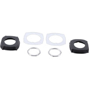 Dark bronze escutcheons and clear gasket rings displayed in component parts arrangement.