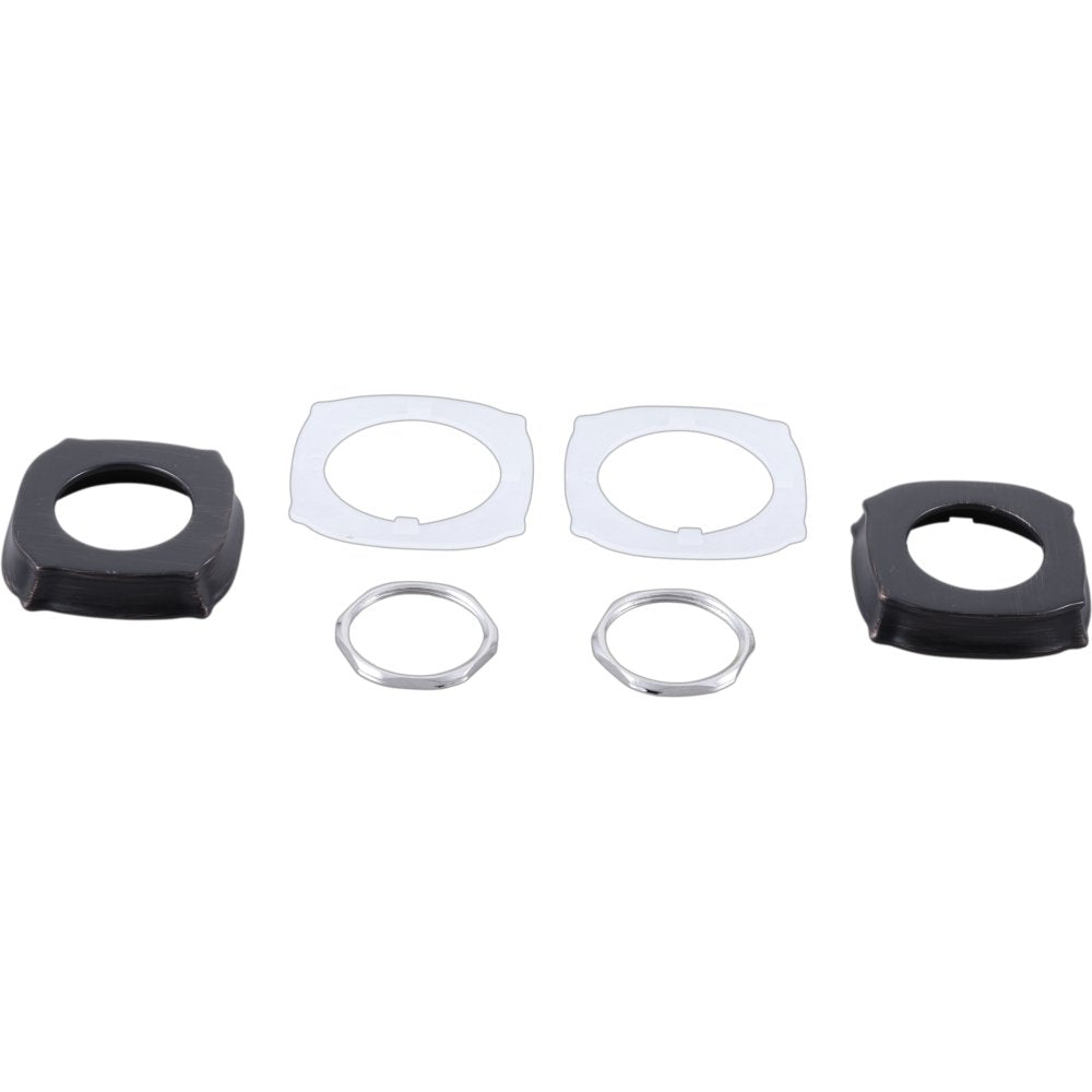 Dark bronze escutcheons and clear gasket rings displayed in component parts arrangement.