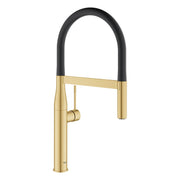 Grohe Essence single-handle kitchen faucet with brushed gold body, black arc spout, and pull-down spray head.