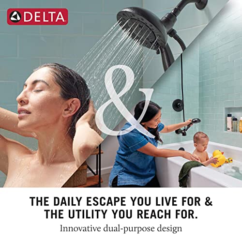 Brushed nickel dual showerhead system with overhead rainfall head and handheld wand mounted on tile wall.
