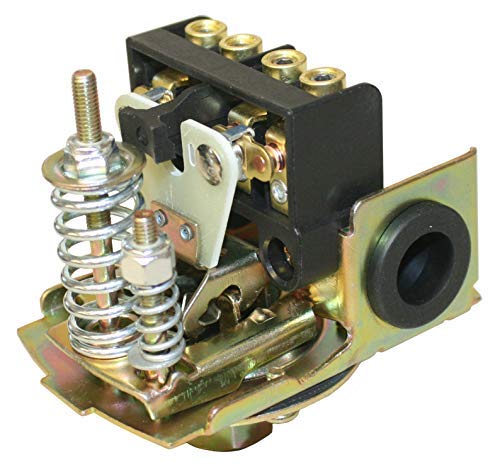 Heavy-duty pressure switch with brass ports, spring mechanism, and black contact housing mounted on yellow-zinc base plate.