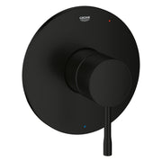Matte black round valve trim with circular backplate, protruding knob handle, and Grohe logo with temperature indicator dots.