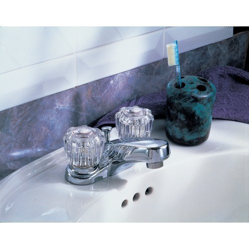 Chrome two-handle centerset bathroom faucet with clear knob handles and pop-up drain on white sink.