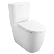 White two-piece elongated toilet with closed seat and tank, right-hand trip lever visible on tank side.