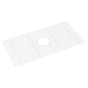 White wire grid sink protector with center drain opening for kitchen sink basin.