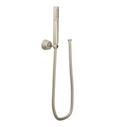 Brushed nickel handheld showerhead with cylindrical head, wall bracket, and coiled hose connection.