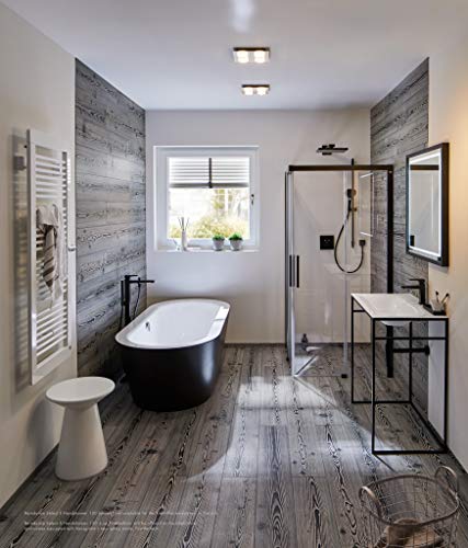 Square matte black thermostatic shower trim with two function controls mounted on bathroom wall.