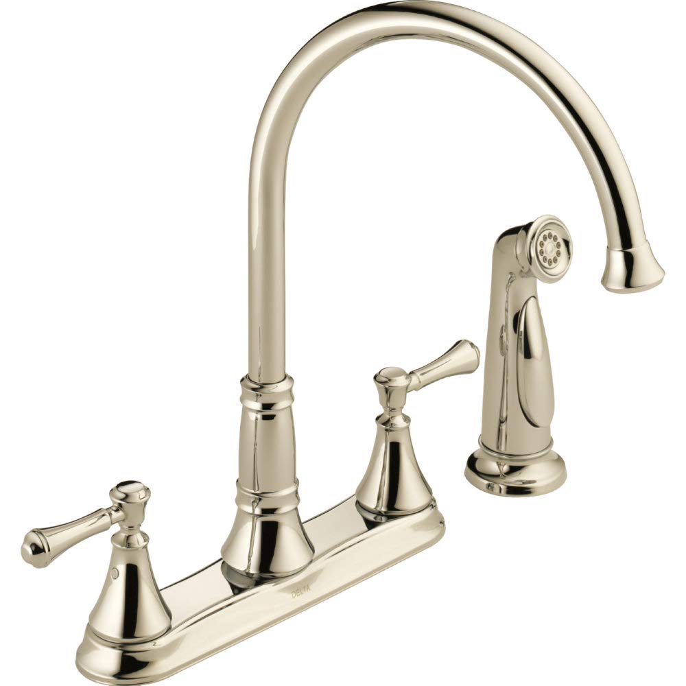 Polished nickel two-handle kitchen faucet with curved spout and detachable spray head on right side.