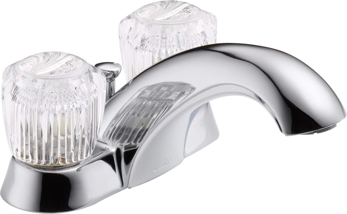 Chrome bathroom faucet with two clear knob handles and curved spout with pop-up drain assembly.