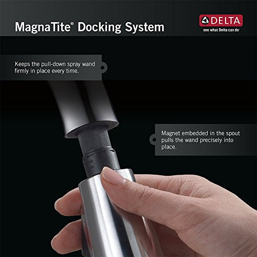 Chrome single-handle pull-down kitchen faucet with spray wand docked in spout using MagnaTite magnetic system.