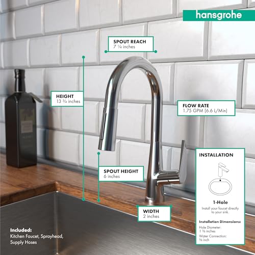 Chrome pull-down kitchen faucet with curved spout and spray head over sink with subway tile backsplash.