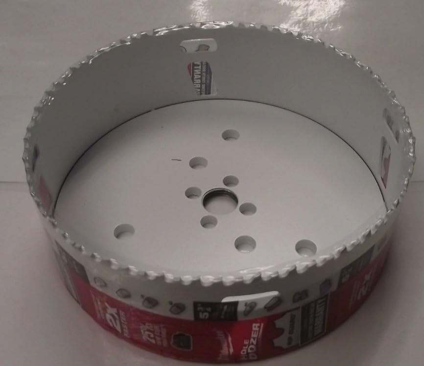 Circular bi-metal hole saw with serrated cutting edge, center pilot bit, and ventilation holes on flat surface.