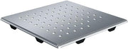 Square stainless steel drain cover with perforated surface and four rubber feet for sink installation.