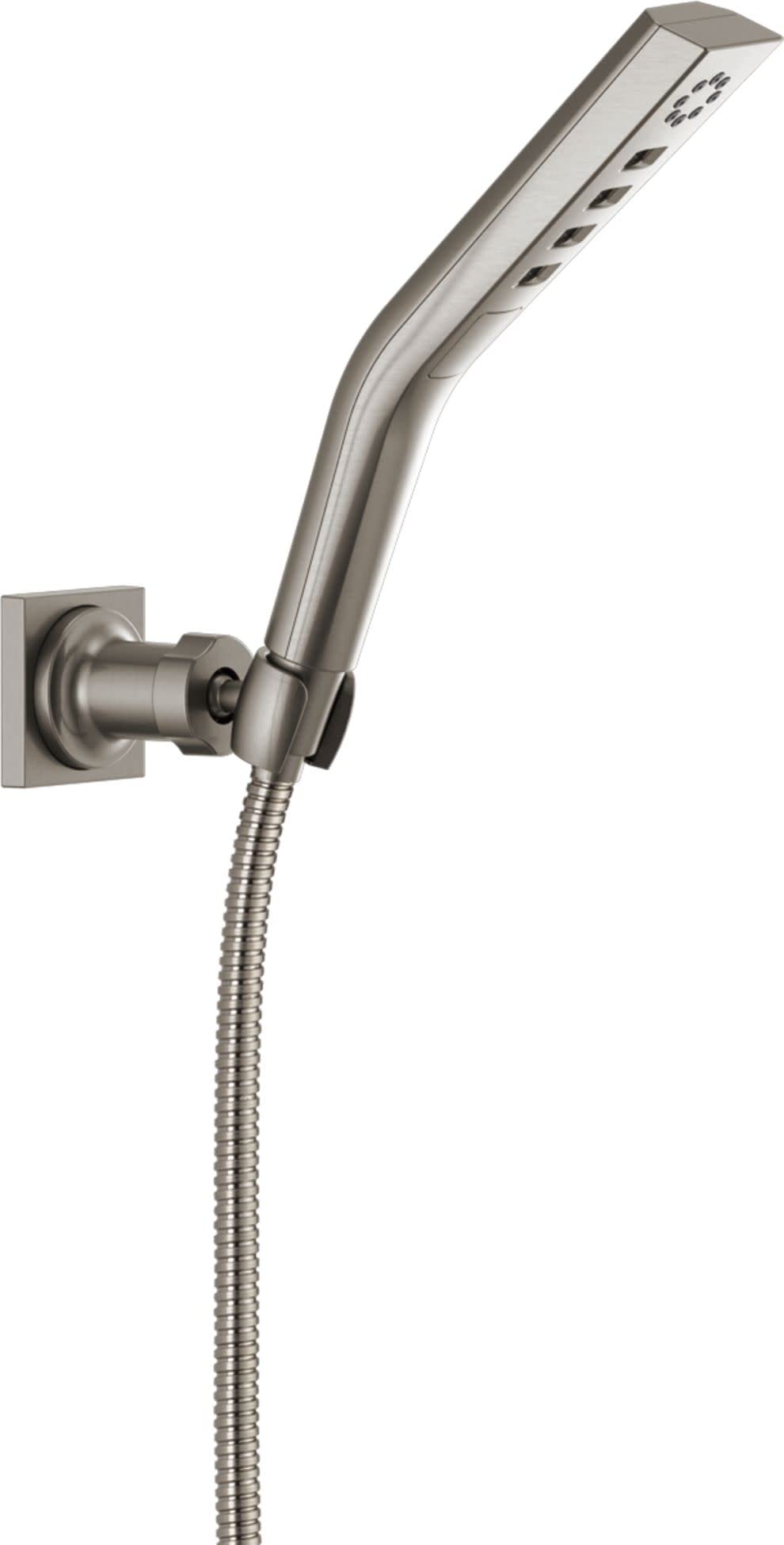 Brushed nickel hand shower with curved body, multiple spray jets, wall mount bracket, and coiled hose connection.