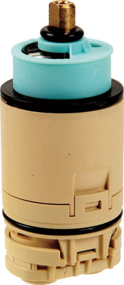 Peerless valve cartridge with brass stem, turquoise and black plastic body, and tan exterior housing.