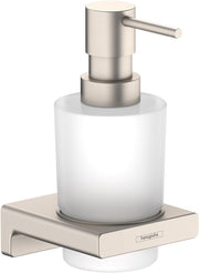 Brushed nickel liquid soap dispenser with white glass bottle mounted on wall bracket.