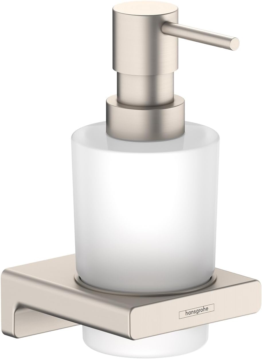 Brushed nickel liquid soap dispenser with white glass bottle mounted on wall bracket.