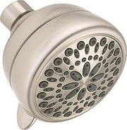 Brushed nickel shower head with multiple spray holes and cylindrical connector on white background.