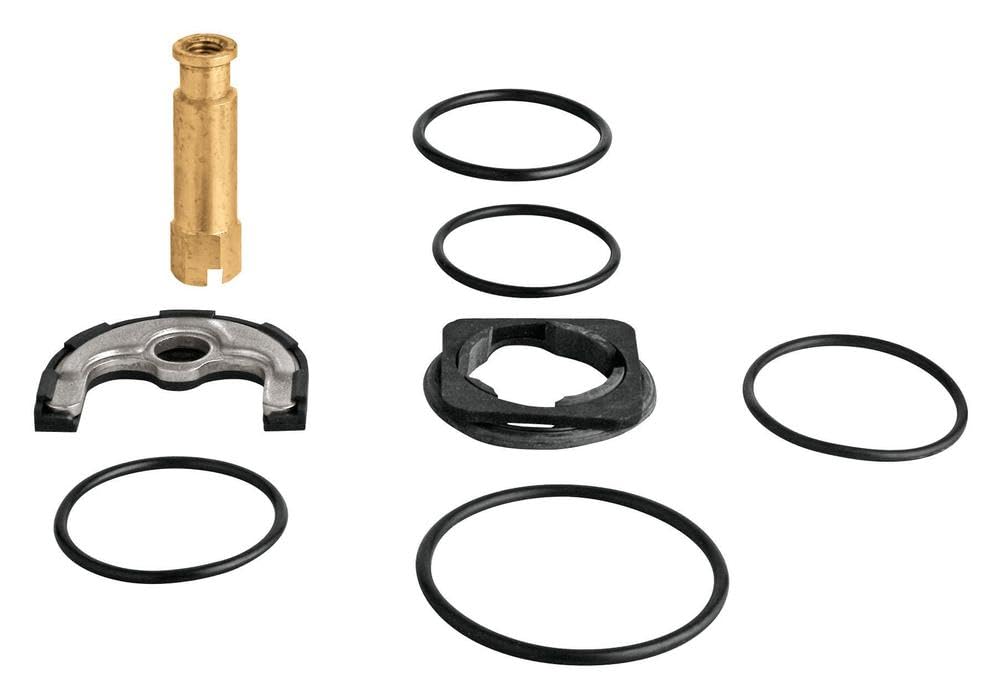 Grohe shank mounting kit containing brass fitting, metal clip, black rubber seals, and gasket rings.