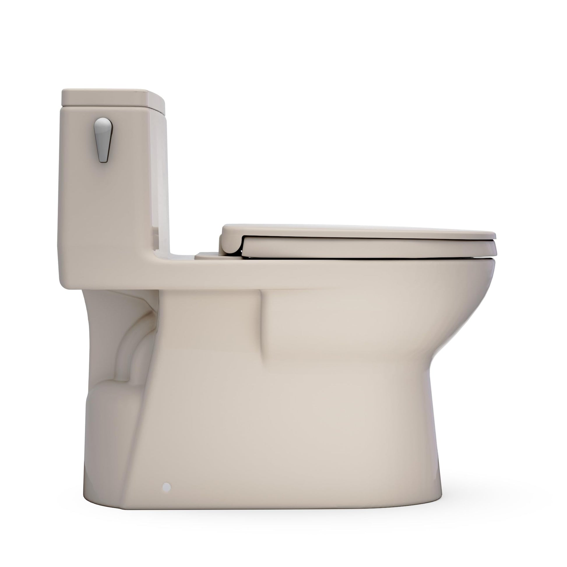 Bone-colored one-piece elongated toilet with integrated tank, closed lid, and lever flush handle.