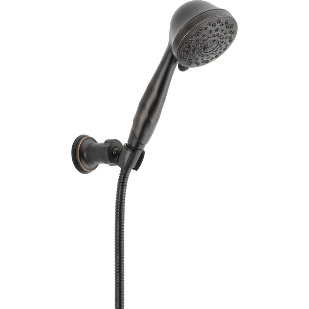Black handheld shower head with perforated face mounted on wall bracket with flexible hose connection.