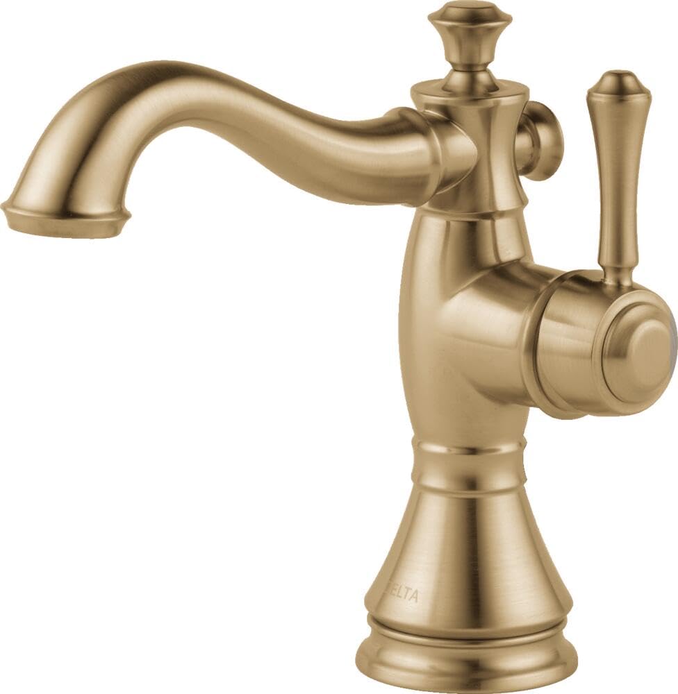 Champagne bronze single-handle bathroom faucet with curved spout, ornamental handles, and pedestal base.