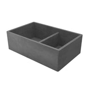 Slate-colored double bowl farmhouse sink with divided compartments and curved interior corners.