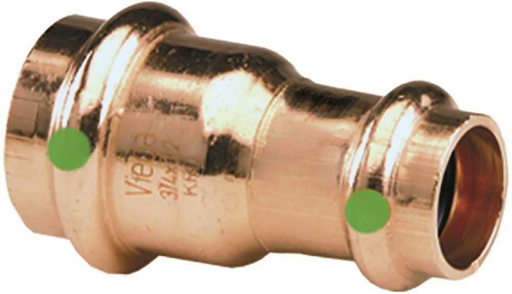 Copper press reducer fitting with larger 1-inch end on left and smaller 3/4-inch end on right, marked with green indicators.