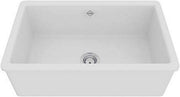 White fireclay kitchen sink with single rectangular basin and drain, viewed from above at an angle.