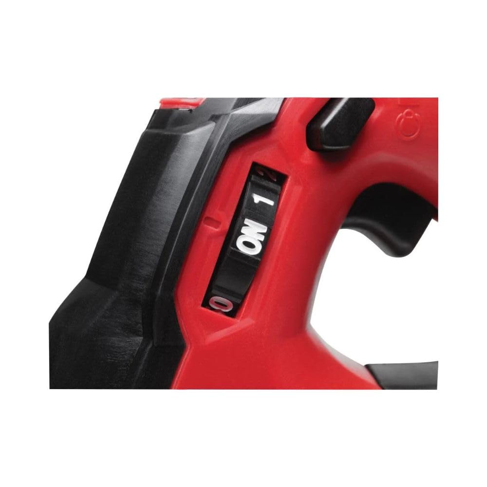 Red and black Milwaukee M18 cordless grease gun with two-speed selector switch and grip handle.