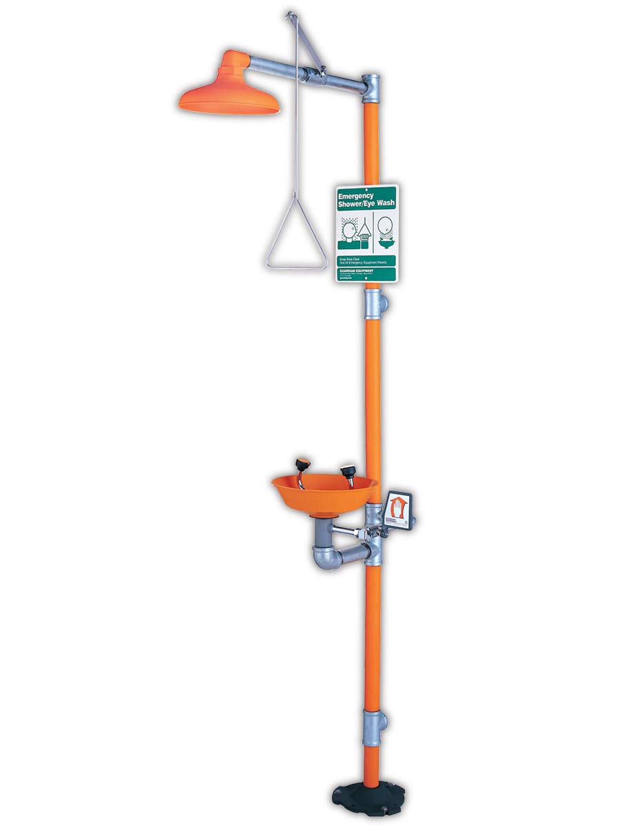 Emergency safety station with orange plastic bowl, overhead shower head, and eye wash nozzle mounted on vertical post.