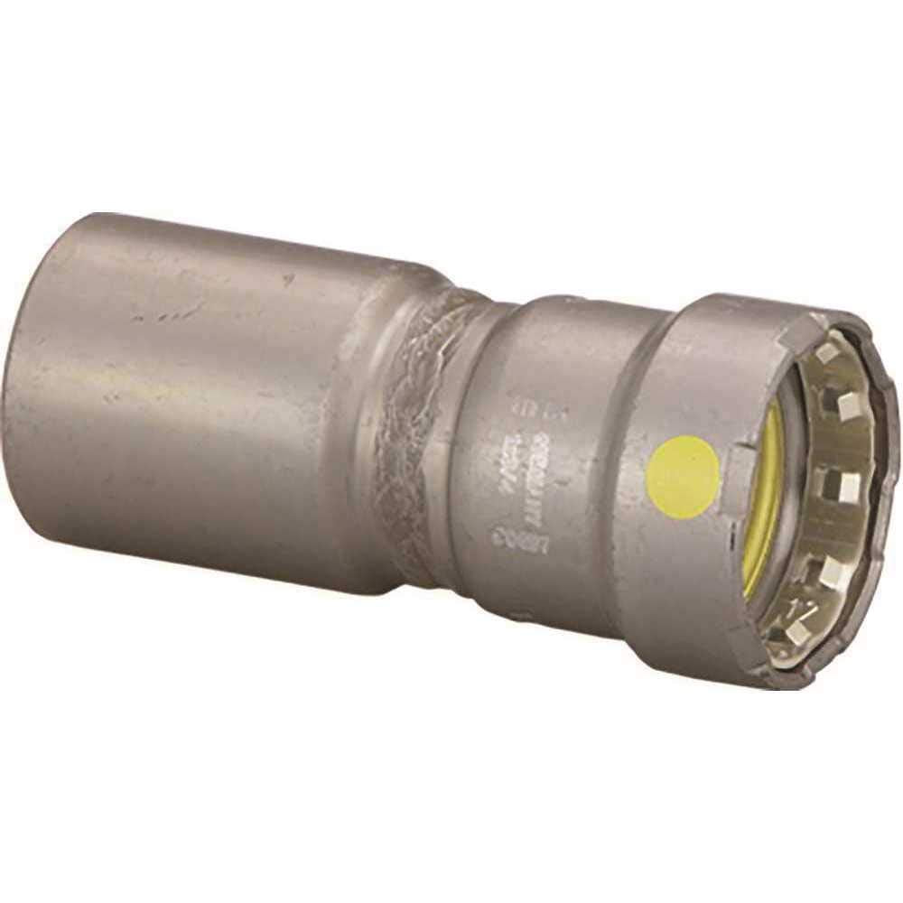 Metallic press reducer fitting with larger diameter on left side, smaller on right, yellow identification dot visible on conn