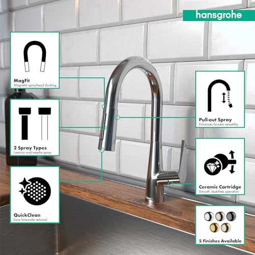 Chrome pull-down kitchen faucet with curved spout and spray head on white subway tile backsplash.