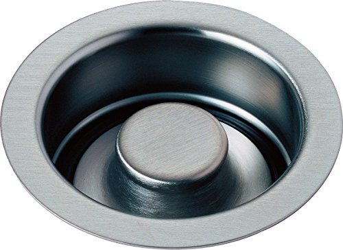 Stainless steel sink flange stopper with brushed finish and circular dome plug insert.