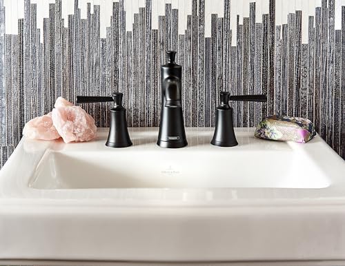 Matte black three-piece widespread faucet with tapered spout and lever handles mounted on white rectangular sink.