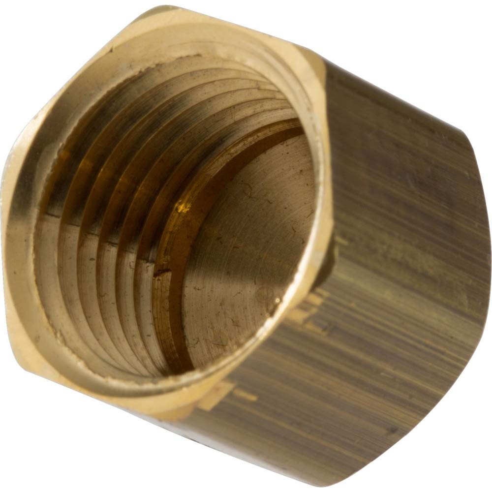 Brass cap with 1/2" female IPS threaded interior connection, hexagonal shape.