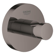 Grohe Essentials robe hook in hard graphite finish with circular mounting plate and cylindrical hook arm.
