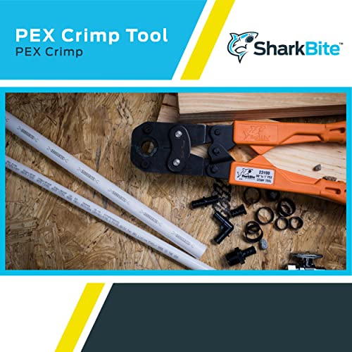 Sharkbite PEX crimp tool kit with orange and black handles, interchangeable heads, and assorted crimp rings displayed on wood