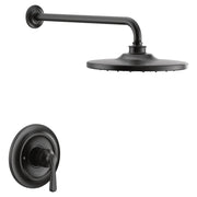 Matte black single-handle shower trim kit with round wall-mounted showerhead and curved arm with control valve.