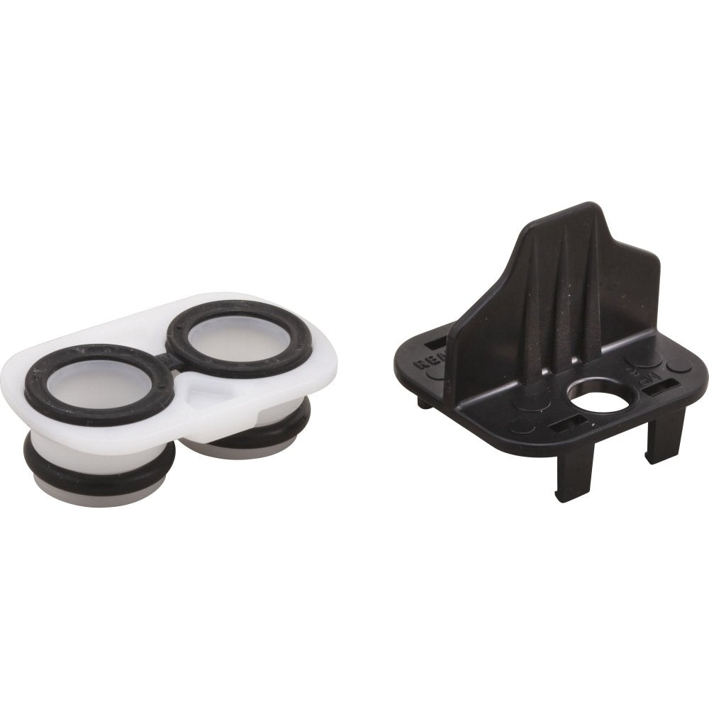 White and black plastic cartridge adapter with two circular openings and mounting tabs for Delta MultiChoice 17 Series.