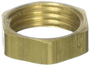 Brass hex nut with grooved sides and threaded interior opening.
