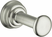 Brushed nickel wall-mounted hook with cylindrical post and circular finial on decorative round backplate.