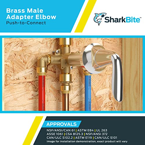 Brass 90-degree elbow fitting with push-to-connect and male threaded connections installed on wooden backing.