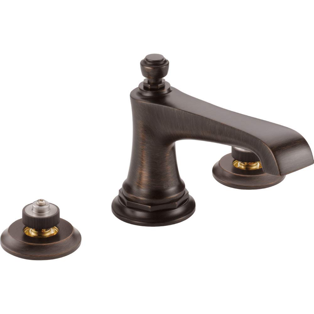 Bronze three-piece widespread lavatory faucet with curved spout and two round base valve controls.