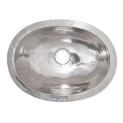 Polished nickel oval undermount sink with hammered texture and single faucet hole.