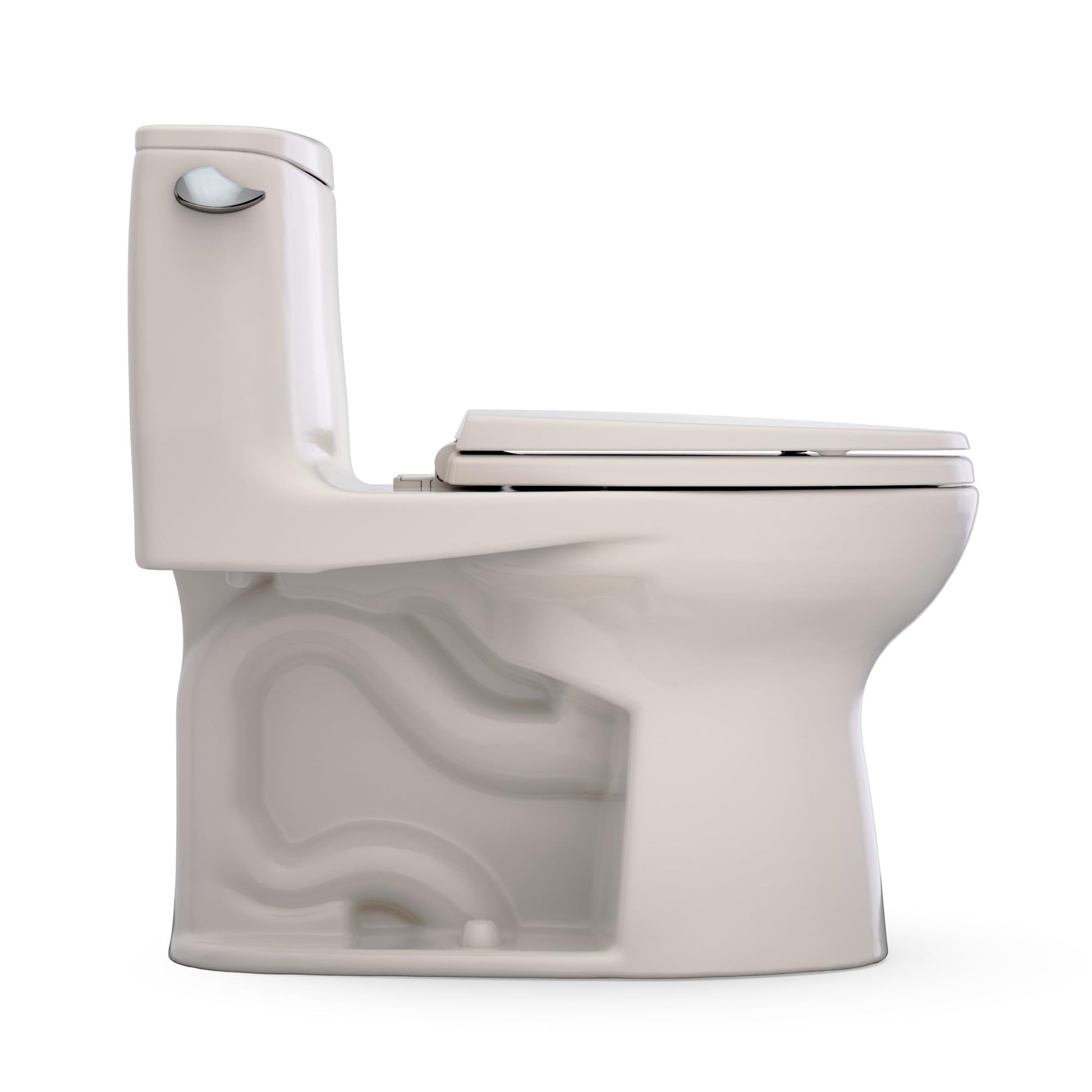 Sedona beige one-piece elongated toilet with dual flush lever and closed seat lid.