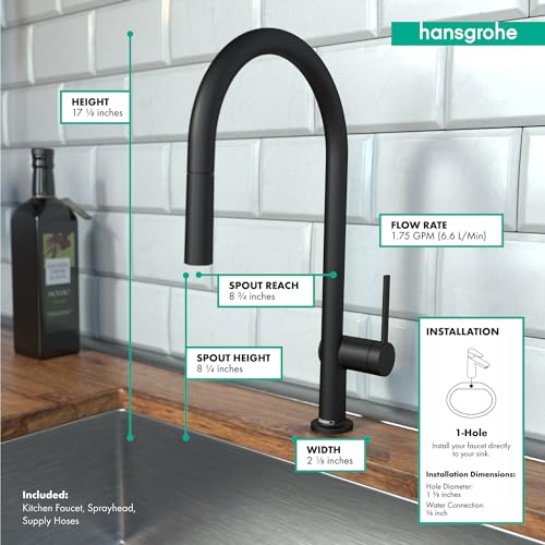 Matte black high-arc kitchen faucet with pull-down spray head mounted on wooden countertop against white tile backsplash.
